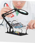 Person using Six Piece Soldering Clamp Adjustable Welding Fixture With Magnifying Glass Lamp Clamp For PCB Board DIY.