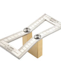 Dead On Dovetail Marking Gauge And Layout Tool Featuring Laser Cut Precision With Dual Angle Blades For No Sweat Woodworking Joints Solid Copper Steel Build For Hardwood And Softwood Projects Silver placed on wooden block.
