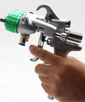 Heavy Duty Double Head Pressure Feed Paint Sprayer Featuring Slick Nano Chrome Nozzles And Killer Smooth Coverage For Badass Industrial Coating And Top Shelf Pneumatic Painting Work With 1000ML Pot Capacity And 13 MM Tips For Flawless Results, held in hand.