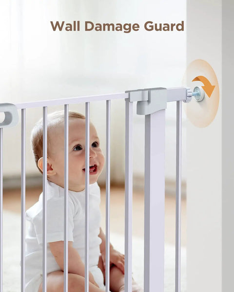 Baby secure behind Adjustable 29.5 To 46 Inch Wide Baby Gate For Stairs And Doorways Extra Wide Auto Close Pet Gate Walk Through Indoor Gate For Kids And Dogs 30 Inch High Easy Pressure Mounted Installation White with wall guard.