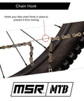 Close-up of bicycle chain on tire with chain hook feature of Four In One Bicycle Chain Pliers For Mountain And Road Bikes Ultra Lightweight