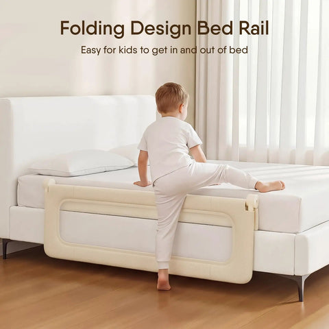 Child climbing on bed with Foldable Toddler Bed Rail Guard With Reinforced Anchor Safety System For King Twin Full And Queen Beds Khaki 59 Inches Long By 21.6 Inches High With Kid Friendly Soft Peach Skin Fabric And Removable Washable Cover attached, in a modern bedroom setting.