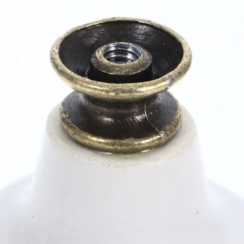 Close-up of Retro Porcelain Cabinet Knobs And Drawer Pulls Set White Ceramic Kitchen Hardware metal fitting detail