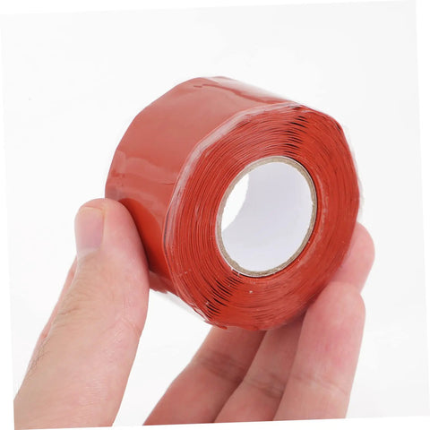 Hand holding red DIY Friendly Pipe Sealing Tape Self Adhesive Sealant For Leak Stop And Plumbing Repairs Flexible Waterproof Tape For Home Use