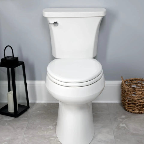 Heavy Duty White Elongated Toilet Seat With Dead Quiet Slow Close Action And Reinforced Wood Core That Locks Down Tight Zero Shift Or Slamming For A Straight Up Hassle Free Easy Install on a modern white toilet.