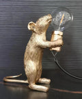Kid Friendly Gold Finish Cute Mouse Desk Lamp With E12 LED Bulb Included, side view, detailed resin mouse holding bulb on dark background.
