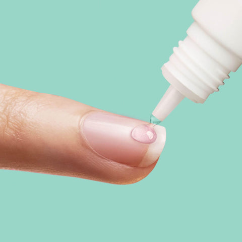 PowerFlex Maximum Speed Nail Glue with Nozzle Tip Applicator being applied to a fingernail for fast drying adhesive repair.