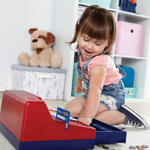 Child playing with Pretend And Play Calculator Cash Register Toy For Kids And Toddlers with Cash Drawer and Play Money on floor