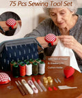 Elderly woman using a 75 Piece Sewing Tool Set With Big Eye Steel Needles, 10 Rolls Jeans Thread, Strawberry Pin Cushion Holders.