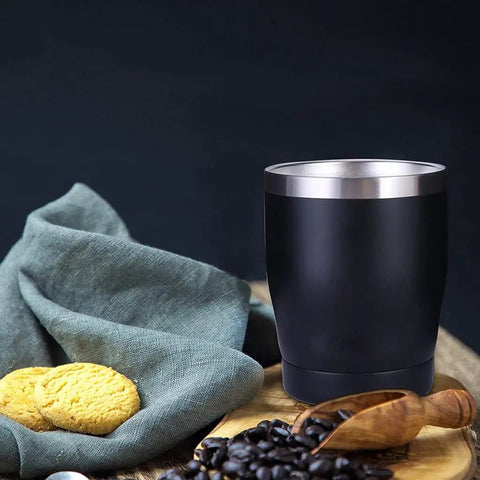 Built Tough 304 Stainless Steel Insulated Travel Mug with cookies and coffee beans, ideal for on-the-go drinks.