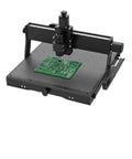 4540 Plus Cnc Router Wood Engraver With 40W Laser Module Grbl Controlled Milling Machine cutting a PCB on a grid surface.