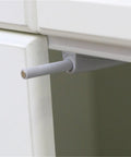 Close-up of Heavy Duty Magnetic Push Latch for Kitchen Cabinets, gray finish, for easy drawer opening, sleek design.