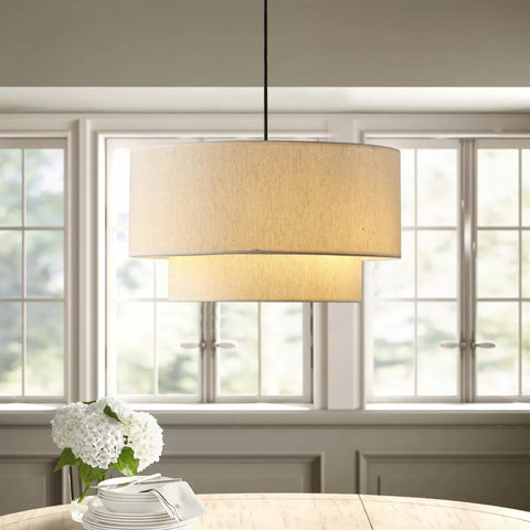 Two Tier Drum Pendant Light With Adjustable Hanging Wire Hassle Free Install And Streamlined Design Nails That Timeless Farmhouse Vibe Flawlessly For Your Kitchen Island Or Family Room Setup Accommodates Three Standard E26 Bulbs, off white linen shade above dining table.