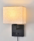 Plug In Wall Sconce Hits Different With Touch Dimmer, matte black metal base, soft cream fabric shade, USB port and AC outlet.
