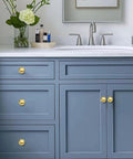 Top Shelf Unlacquered Brass Cabinet Knobs on blue bathroom vanity, 1 Inch Round Vintage Hardware, 5 Pack.
