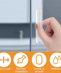 Mini Self Adhesive Clear Acrylic Cabinet Drawer Pulls 2 Pack No Punching Design Push Pull Handles attached to a glass panel