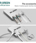 Eight In One Manicure And Pedicure Kit With Stainless Steel Nail Clippers Personal Care Tools In Durable PU Leather Case Green Finish For At Home Grooming And Travel, Includes Oblique Clipper, Facial Hair Scissors, Eyebrow Tweezer And Nail File on display.