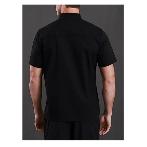 Back view of personalized chef coat custom embroidered name, black, heavy cotton, professional kitchen workwear for line cooks.