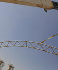 1 Inch by 4 Foot Flat Loop Eye to Eye Lifting Sling with Protective Sleeve lifting a metal structure on crane