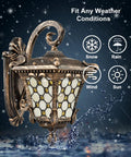 Outdoor Wall Lantern With Tiffany Glass Shade, Weatherproof Die Cast Aluminum, Rust Resistant Black And Brushed Brass Finish in rain