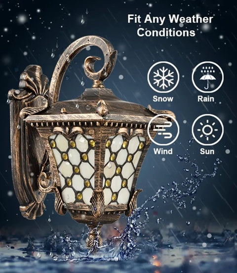 Outdoor Wall Lantern With Tiffany Glass Shade, Weatherproof Die Cast Aluminum, Rust Resistant Black And Brushed Brass Finish in rain