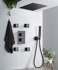 Slick Matte Black Rain Shower System With 10 Inch Ceiling Mounted Rainfall Head And Handheld Sprayer with body jets.