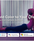 Woman doing yoga with pink lighting from Color Changing WiFi LED Bulbs A19 850 Lumens 9.5W Dimmable, showcasing vibrant colors.