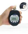 Portable Digital Shore A Durometer Hardness Tester Meter with Big LCD Screen held in hand displaying 99.5 hardness value.