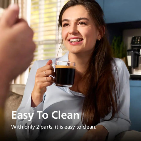 Woman enjoying coffee near Fully Automatic Espresso Machine With Built In Grinder And Milk Frother, visible on kitchen counter