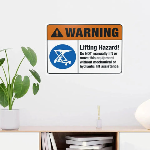 Heads Up Lifting Hazard Do Not Manually Lift Or Move This Equipment 8x12 inch safety sign on wall of industrial workspace