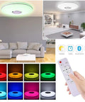 Living room with 36W LED Music Ceiling Light With Bluetooth Speaker, RGB Color Changing Flush Mount Lamp, remote in hand.
