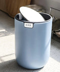 Ultra Compact 1.5L Mini Tabletop Trash Can With Swing Lid For Bathroom Vanity Or Desk Space Saving 4.7 Inch Diameter 6.5 Inch Tall Small Garbage Bin For Office Countertop in blue on counter
