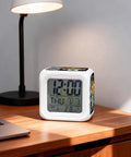 Snazzy Silent Digital Alarm Clock With Sweet Snooze And Cool Nightlight Compact Vintage Grid Cube Design displaying time and date on a nightstand.