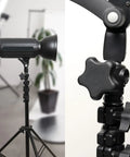 Close-up of 10 Pack Five Star Knobs With 5/16-18 Threaded Studs on adjustable light stand in a studio setting.