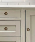 Old School Antique Brass Cabinet Knobs With Backplates 2.5 Inch 10 Pack Vintage Drawer Knobs For Cabinets Closets Dressers And Bi Fold Doors Durable Zinc Alloy Hardware shown on white drawers and cabinet doors.