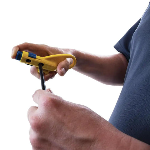 Man using Data And Coax Cable Stripping Tool With Radial Design For RG59 RG6 And CAT3 To CAT6A, focusing on adjustable blades.