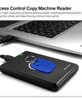 Dual Frequency Access Card Copier And RFID Writer Reader 125KHz 13.56MHz With NFC Tag Replicator next to a laptop, black color