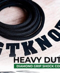 Diamond Grip Black Bungee Cord One Eighth Inch by One Hundred Feet Ultra Stretch Elastic Shock Cord on wooden surface