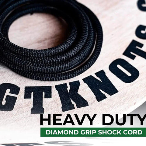 Diamond Grip Black Bungee Cord One Eighth Inch by One Hundred Feet Ultra Stretch Elastic Shock Cord on wooden surface
