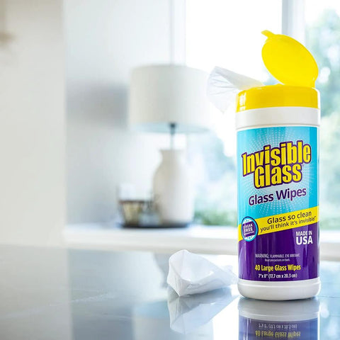 Invisible Glass Wipes bottle with yellow cap; pre-moistened, streak-free glass wipes for windows and mirrors.