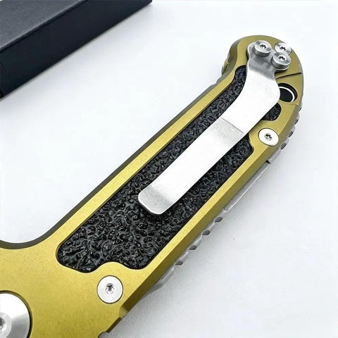 Close-up of the green aviation aluminum handle with pocket clip on the Beefy 7.9 Inch Button Lock Folding Pocket Knife.