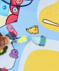 Player using a brush on stickers in the Legit Awesome Bluey Pediatrician Board Game For Kids Featuring Electronic Talking Sound Effects.