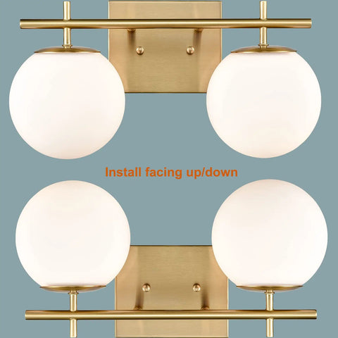 Gold Two Light Wall Sconce With Brass Finish And Milky White Glass Globe, Modern Vanity Light For Bathrooms, shown in both orientations.