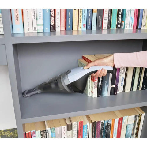 Cordless Handheld Vacuum Cleaner For Home And Car With Crevice Attachment cleaning bookshelf with books and wall mounted charger