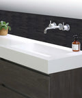 Self Adhesive Brushed Aluminum Backsplash Tiles for kitchen and fireplace shown behind modern sink, easy clean, DIY install