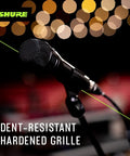 Nexadyne 8 S Supercardioid Dynamic Vocal Mic With Revonic Dual Engine Technology for live gigs on stage against bokeh lights.