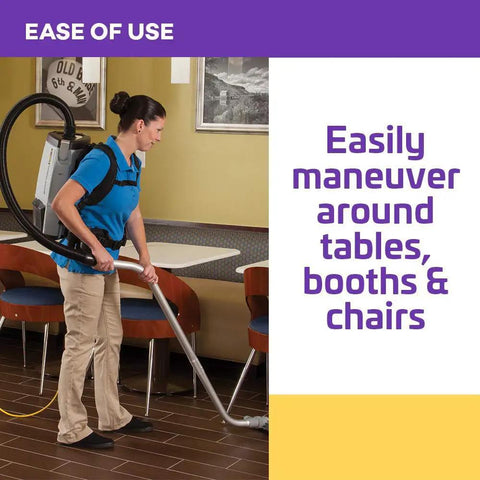 User easily maneuvers Heavy Duty Commercial Backpack Vacuum With Slick HEPA Media Filtration around restaurant tables.