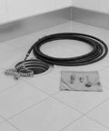 Heavy Duty Flexible Chain Knocker Drain Snake Auger With Solid Steel Core, 16mm shaft beside a floor drain and tools.