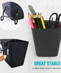 Pegboard Organizer Set 16 Pack With Bins Baskets Cups Hooks And J Hooks For One Eighth And One Quarter Inch Pegboards black holder with pencils and scissors on pegboard.