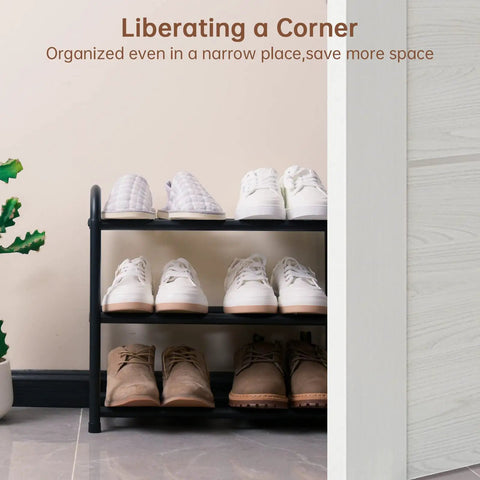 Expandable Three Tier Metal Shoe Rack For Entryway Closet And Doorway Free Standing Heavy Duty Organizer Holds Up To Twelve Pairs Of Shoes Easy To Assemble Space Saving Black in corner with shoes
